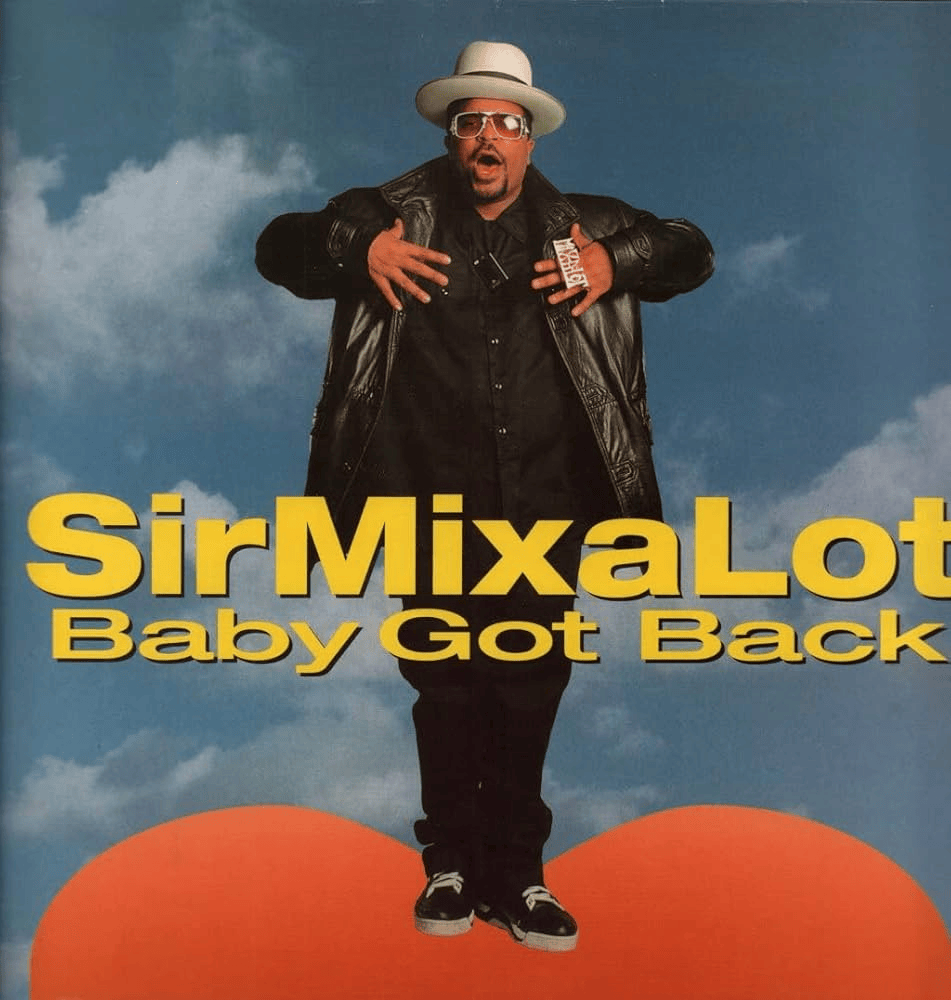 Album cover of Sir Mix-A-Lot's 'Baby Got Back' featuring the artist in a black outfit and sunglasses, standing against a blue sky with a large red heart at the bottom.